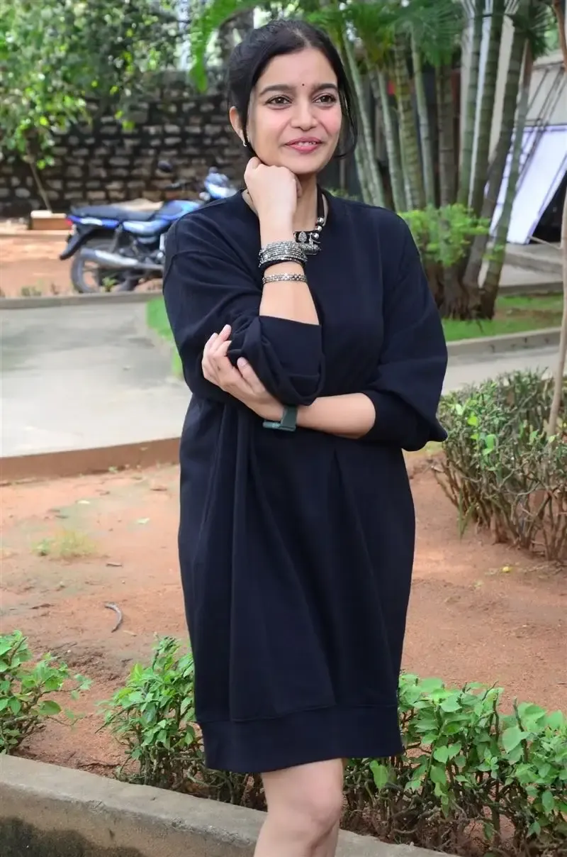 Actress Colors Swathi in Black Dress at Month Of Madhu Movie Press Meet